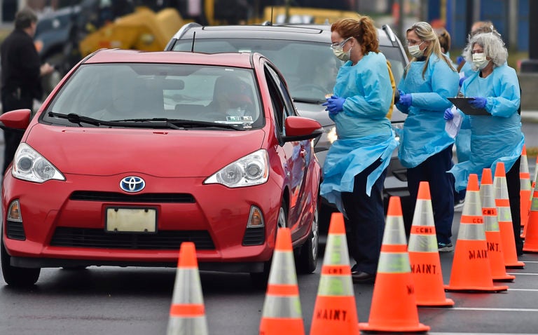 Nurses with ChristianaCare test people for the coronavirus in downtown Wilmington on March 13, 2020. (Butch Comegys for WHYY)