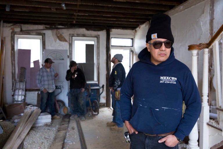 Javier Garcia Hernandez, a project manager with the Philadelphia construction cooperative MexCon, inspects a job site on Jan. 10, 2020. (Rachel Wisniewski / For WHYY)