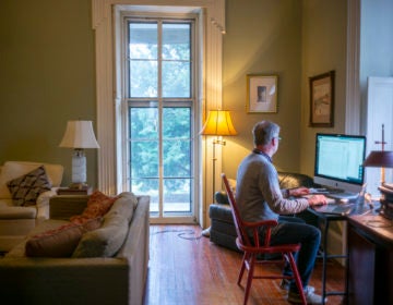 Michael Prell, who works in IT, working from home in his living room (Jessica Kourkounis for Keystone Crossroads)
