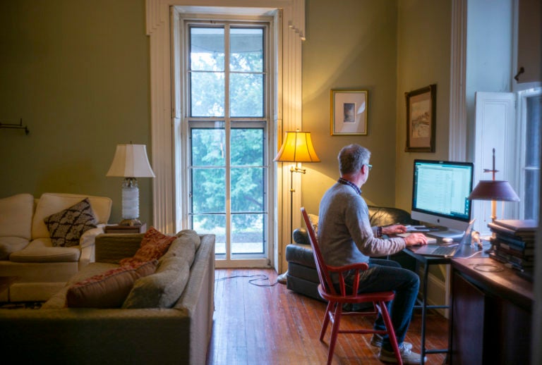 Michael Prell, who works in IT, working from home in his living room (Jessica Kourkounis for Keystone Crossroads)