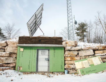 The set up on Stone Mountain consists of a radio tower, solar panels and an equipment room and is key to how the Rural Broadband Cooperative is delivering broadband internet to its users. (Min Xian/Keystone Crossroads)