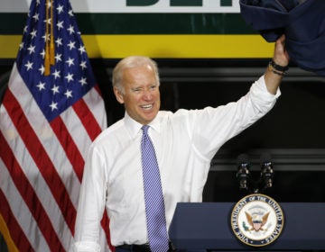 Then-Vice President Joe Biden exits after touring a new bus in Detroit in September 2015. (Paul Sancya/AP Photo)