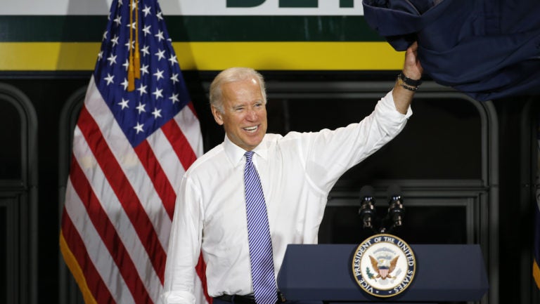 Then-Vice President Joe Biden exits after touring a new bus in Detroit in September 2015. (Paul Sancya/AP Photo)