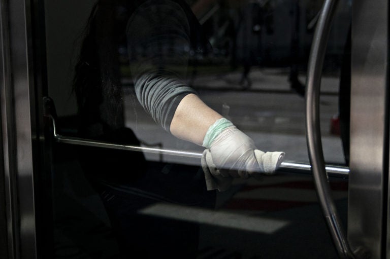 When an infected person touches a surface, like a door handle, there’s a risk they leave viruses stuck there that can live on for two to three days. When an infected person touches a surface, like a door handle, there's a risk they leave viruses stuck there that can live on for two to three days. (Andrew Harrer/Bloomberg via Getty Images)