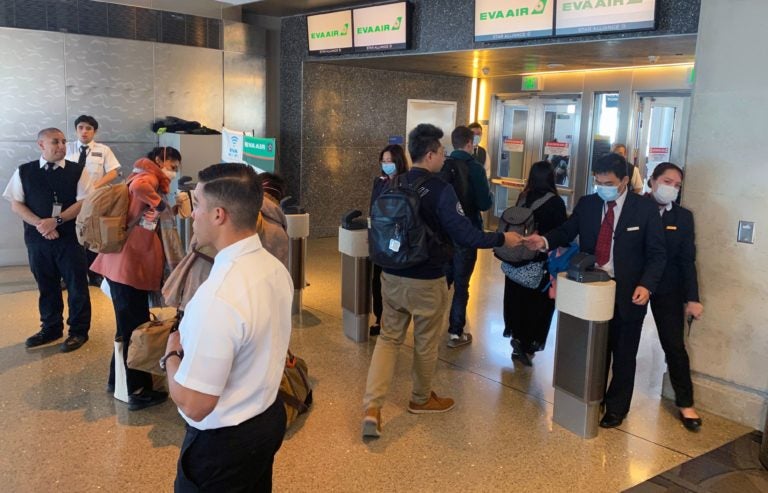 Humans — workers and flight crews as well as passengers — can be exposed to any number of pathogens at airports. (Daniel Slim/AFP via Getty Images)