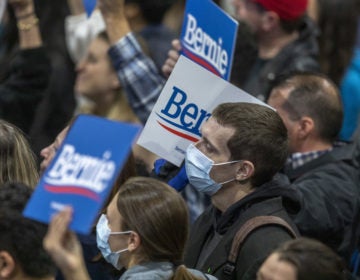 Supporters wear medical masks, as fears of coronavirus increase in California, during a campaign rally for Presidential candidate Sen. Bernie Sanders in Los Angeles on March 1, 2020. (David McNew/Getty Images)