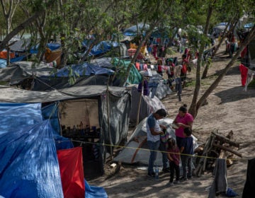 Clothing hangs to dry at a makeshift migrant camp for asylum seekers in Matamoros, Tamaulipas state, Mexico, on earlier this month. About 60,000 migrants live in filthy and dangerous conditions as they await their day in U.S. immigration court. (Alejandro Cegarra/Bloomberg via Getty Images)