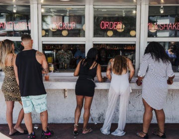 Customers at this take-out window in Miami on March 20 were not practicing social distancing. (Scott McIntyre/Bloomberg via Getty Images)
