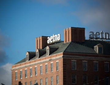 Aetna was the first insurer to announce its plan to help shield patients with COVID-19 from high medical bills. But out-of-network charges and other surprise bills remain a risk, say advocates for patients.  (Michael Nagle/Bloomberg via Getty Images)