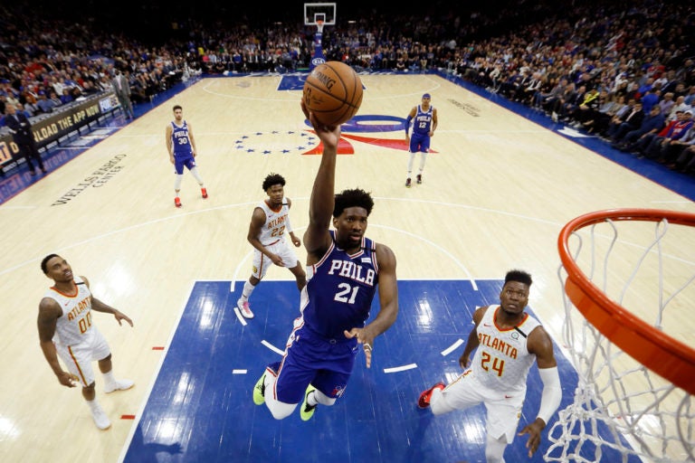 Philadelphia 76ers' Joel Embiid (21) goes up to shoot during the first half of an NBA basketball game against the Atlanta Hawks, Monday, Feb. 24, 2020, in Philadelphia. (AP Photo/Matt Slocum)