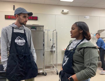 Rebel Ventures co-executive director Jarrett Stein talks with Kennysha Stanley. He and other mentors nominated her for the Breakfast Hero Award. (The Notebook)