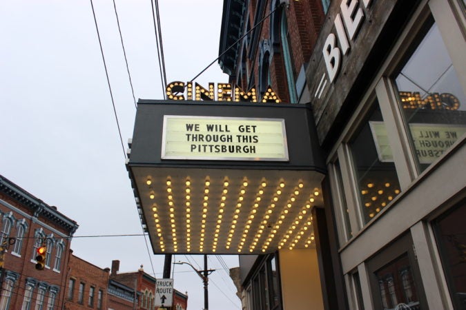 The marquee of Row House Cinema in Pittsburgh’s Lawrenceville neighborhood was changed to encourage unity while people self-isolate due to the coronavirus spread. (Katie Blackley/WESA)