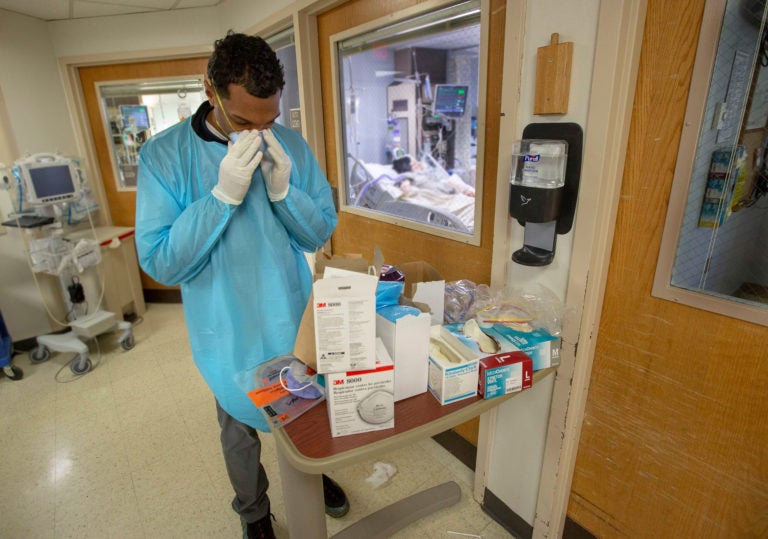 Dr. Clenton Coleman adjusts his mask inside the ICU of Holy Name Medical Center in Teaneck, New Jersey,  March 19, 2020. (Jeff Rhode /Holy Name Medical Center)