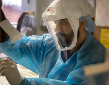 Ranvir Singh, a registered nurse in the  intensive care unit at Holy Name Medical Center in Teaneck, New Jersey, tends to a patient March 19. 2020. (Jeff Rhode/Holy Name Medical Center.)