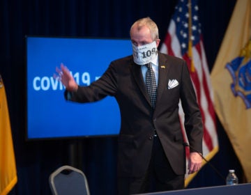 New Jersey Governor Phil Murphy wearing a mask that says 'EXIT 109' for his daily coronavirus briefing on Wednesday, April 8, 2020. (Pool photo by Michael Mancuso | NJ Advance Media for NJ.com)