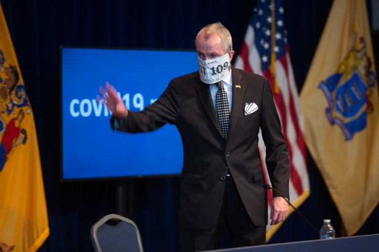 New Jersey Governor Phil Murphy wearing a mask that says 'EXIT 109' for his daily coronavirus briefing on Wednesday, April 8, 2020. (Pool photo by Michael Mancuso | NJ Advance Media for NJ.com)