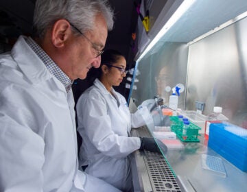 Dr. David Weiner and Dr. Ami Patel work on synthetic DNA technology.