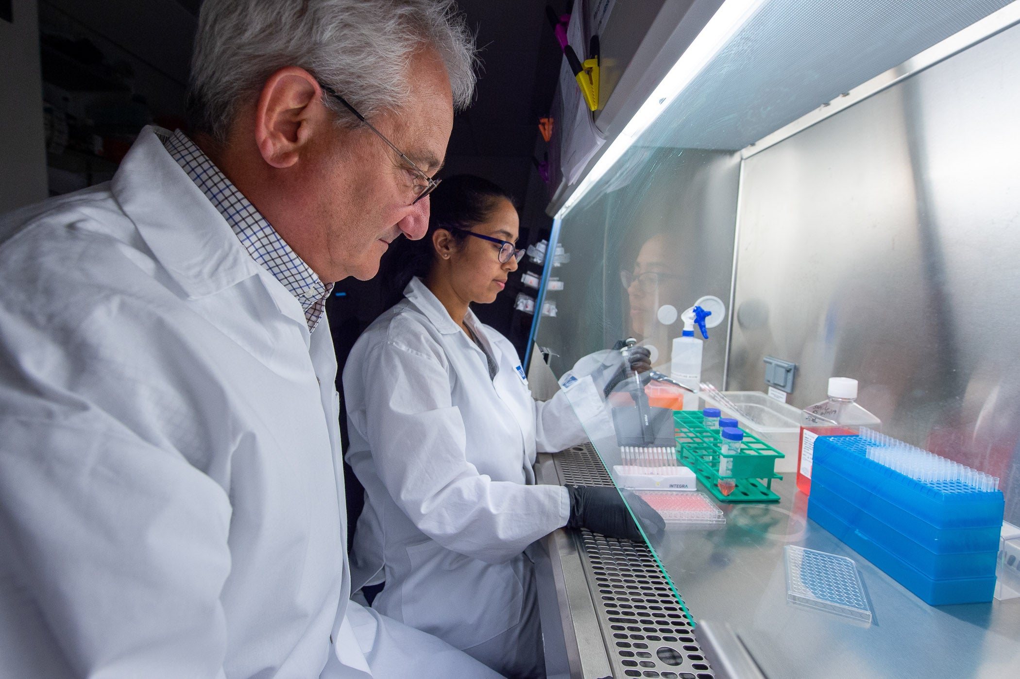 Dr. David Weiner and Dr. Ami Patel work on synthetic DNA technology.