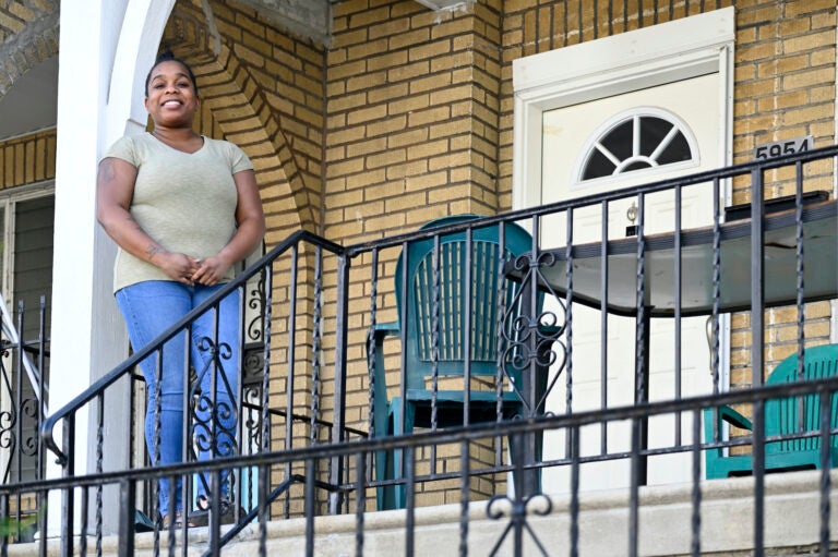 Evelyn Coates stands on the porch of her home in West Oak Lane on Tuesday, April 14, 2020. (Bastiaan Slabbers for WHYY)