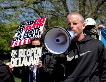 Rally organizer Jim McGuckin urges the Delaware government to allow businesses to reopen