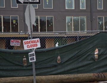 Workers on the job at 19th and Reed Streets in South Philadelphia. (Kimberly Paynter/WHYY)