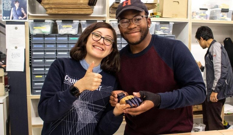 Haverford College freshman, Rasaaq Shittu (right) and Bella Merchant (Bryn Mawr ‘21) at a 3D-prosthetics charity workshop at Haverford's Maker Space before coronavirus pandemic. (Photo courtesy of Rasaaq Shittu)