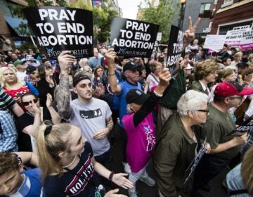 Anti-abortion protesters rally near a Planned Parenthood clinic in Philadelphia, Friday, May 10, 2019. The demonstration was spurred by the actions of a Democratic state lawmaker who recorded himself berating an anti-abortion demonstrator at length outside the clinic. (AP Photo/Matt Rourke)