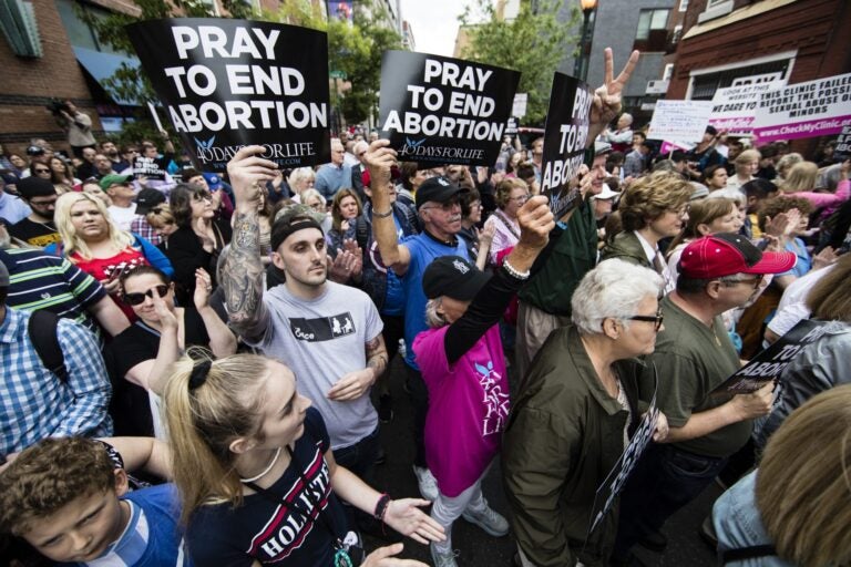 Anti-abortion protesters rally near a Planned Parenthood clinic in Philadelphia, Friday, May 10, 2019. The demonstration was spurred by the actions of a Democratic state lawmaker who recorded himself berating an anti-abortion demonstrator at length outside the clinic. (AP Photo/Matt Rourke)