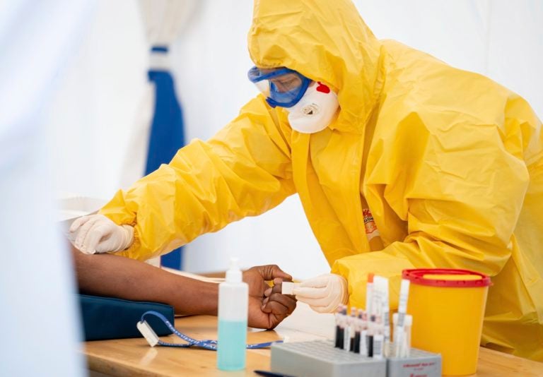 A paramedic takes blood from a patient in Berlin. (Kay Nietfeld/picture-alliance/dpa/AP Images)