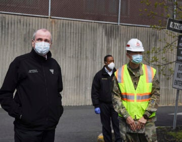 New Jersey Gov. Phil Murphy, left, visits an alternate care facility at East Orange Hospital in East Orange, N.J., amid the coronavirus pandemic, on Wednesday, April 22, 2020. (Michael Karas/The Record via AP, Pool)