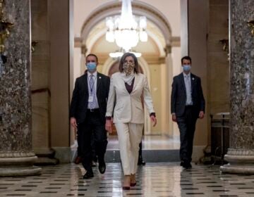 In this April 23, 2020 photo House Speaker Nancy Pelosi of Calif., walks to her office after signing the Paycheck Protection Program and Health Care Enhancement Act, H.R. 266, after it passed the House on Capitol Hill in Washington. (Andrew Harnik/AP Photo)