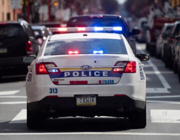 A Philadelphia Police Department cruiser is seen traveling down a Philly street.
