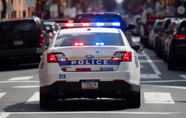 A Philadelphia Police Department cruiser is seen traveling down a Philly street.
