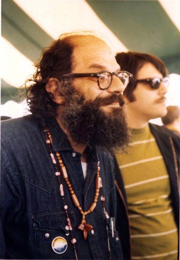 Allen Ginsberg smiles.