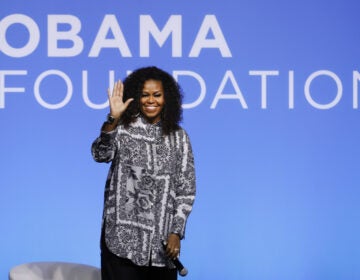 Former U.S. first lady Michelle Obama waves as she attends an event for Obama Foundation in Kuala Lumpur, Malaysia, in December 2019. Obama and actress Julia Roberts attended the inaugural Gathering of Rising Leaders in the Asia Pacific organized by the Obama Foundation. (Vincent Thian/AP Photo)