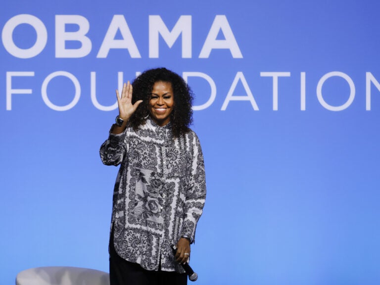 Former U.S. first lady Michelle Obama waves as she attends an event for Obama Foundation in Kuala Lumpur, Malaysia, in December 2019. Obama and actress Julia Roberts attended the inaugural Gathering of Rising Leaders in the Asia Pacific organized by the Obama Foundation. (Vincent Thian/AP Photo)