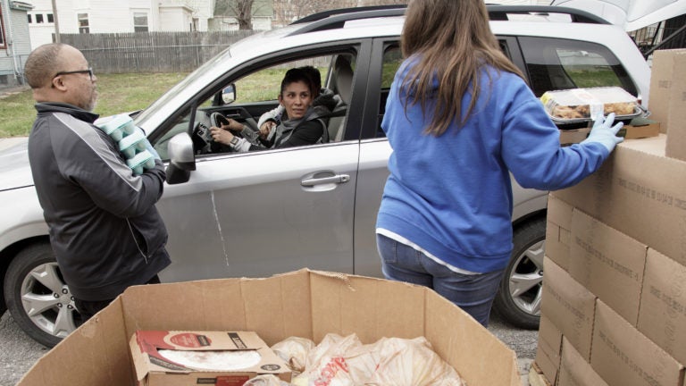 Together Inc. food bank workers distribute food at a drive-through location in Omaha, Neb., last week. Disruptions in the agricultural supply chain caused by the coronavirus pandemic are making it difficult for food banks. (Nati Harnik/AP Photo)