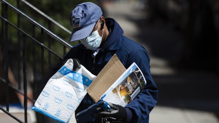 Because of the coronavirus, mail volume is down, and the U.S. Postal Service says it may run out of money by this summer. (Matt Rourke/AP)