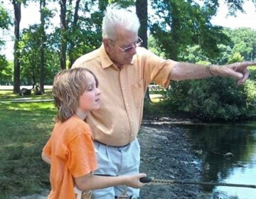 Charlie Secrest teaches his grandson, Connor, to fish at Bellevue State Park. (Provided by Terri Hansen)