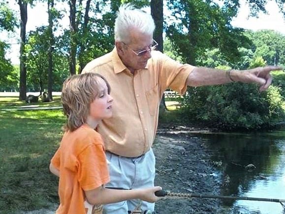 Charlie Secrest teaches his grandson, Connor, to fish at Bellevue State Park. (Provided by Terri Hansen)