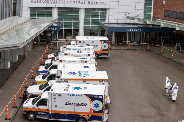 Emergency medical technicians wheel a patient into the ER of Massachusetts General Hospital in Boston. (Stan Grossfeld/Boston Globe via Getty Images)