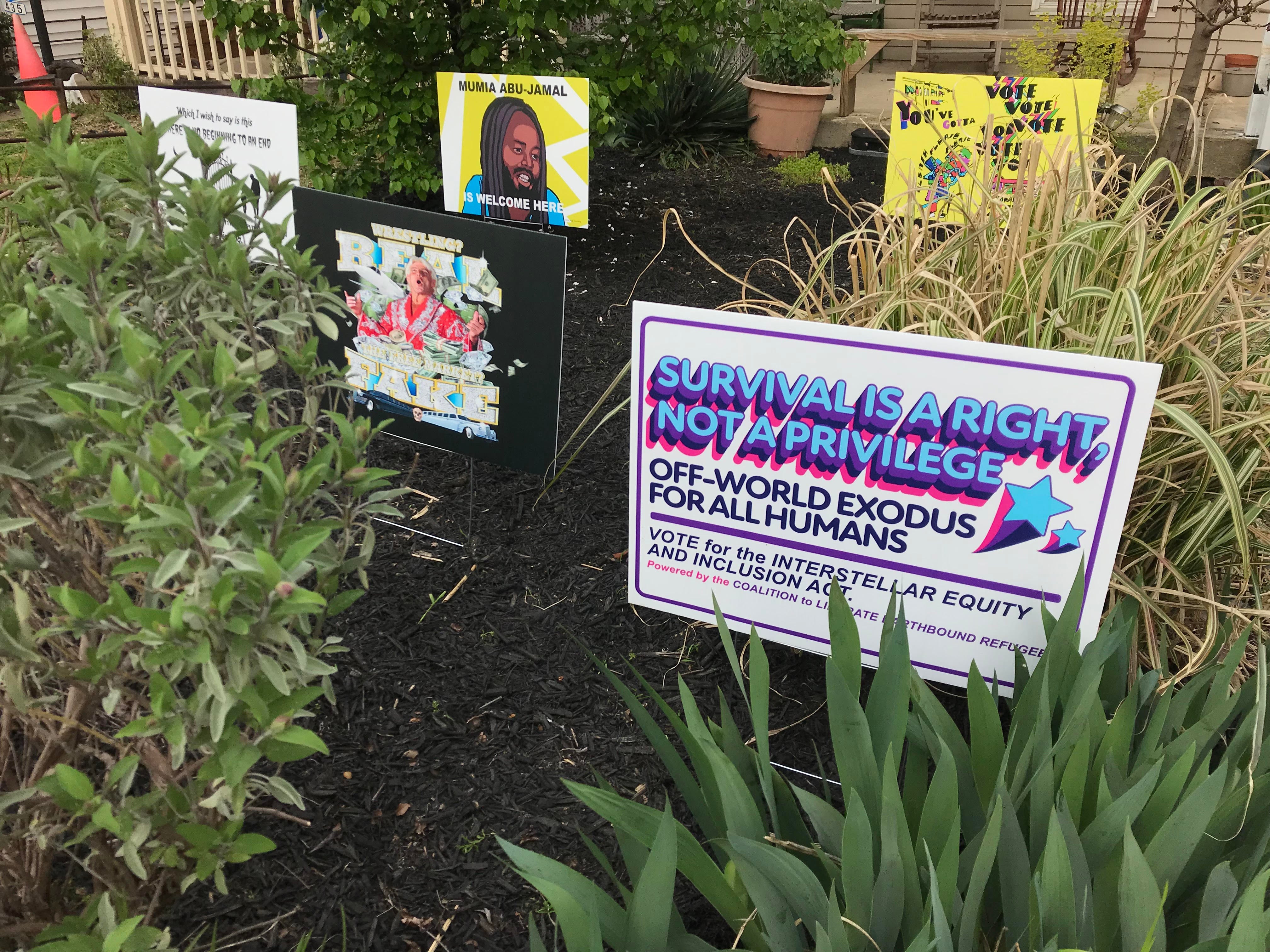 Daniel Tucker and Emily Bunker invited artists to make signs for display in their yard.