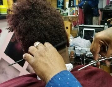 The Pennsylvania government doesn’t consider barbershop essential businesses. But some people who work in them, and who visit, disagree. (Andrea Gibbs/WHYY)