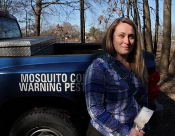 Entomologist Autumn Angelus prepares to set out on a mosquito collecting expedition at Elmer Lake Wildlife Management Area in Salem County, New Jersey. (Emma Lee/WHYY)