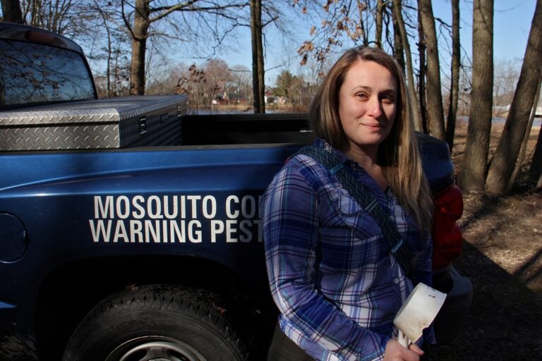 Entomologist Autumn Angelus prepares to set out on a mosquito collecting expedition at Elmer Lake Wildlife Management Area in Salem County, New Jersey. (Emma Lee/WHYY)