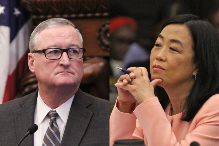 City Councilmember Helen Gym and Mayor Jim Kenney. Gym has challenged proposed cuts to city housing programs. (Emma Lee/WHYY)