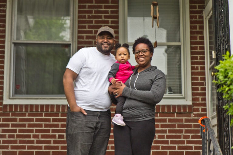 Jordan and Nyla Ford with their 14-month-old daughter Noelle at their home in Philadelphia. (Kimberly Paynter/WHYY)
