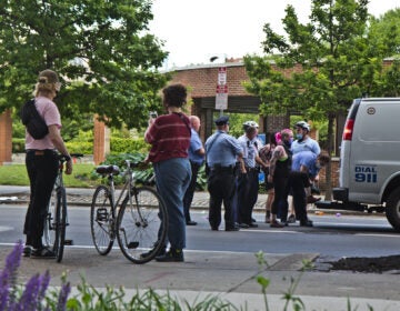 Police arrest a protester next to Independence Mall on Sunday afternoon. (Kimberly Paynter/WHYY)