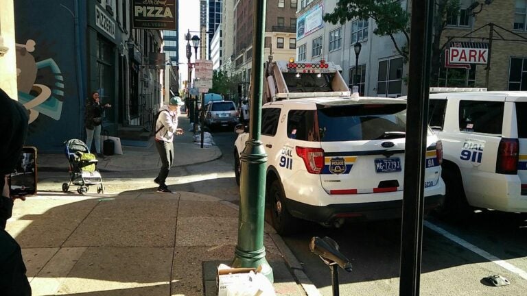 A still from a video showing homeless outreach workers appearing at 2000 block of Ionic Street in Rittenhouse to clean up an encampment. 