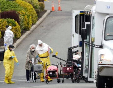 Residents from St. Joseph's Senior Home are helped on to buses in Woodbridge